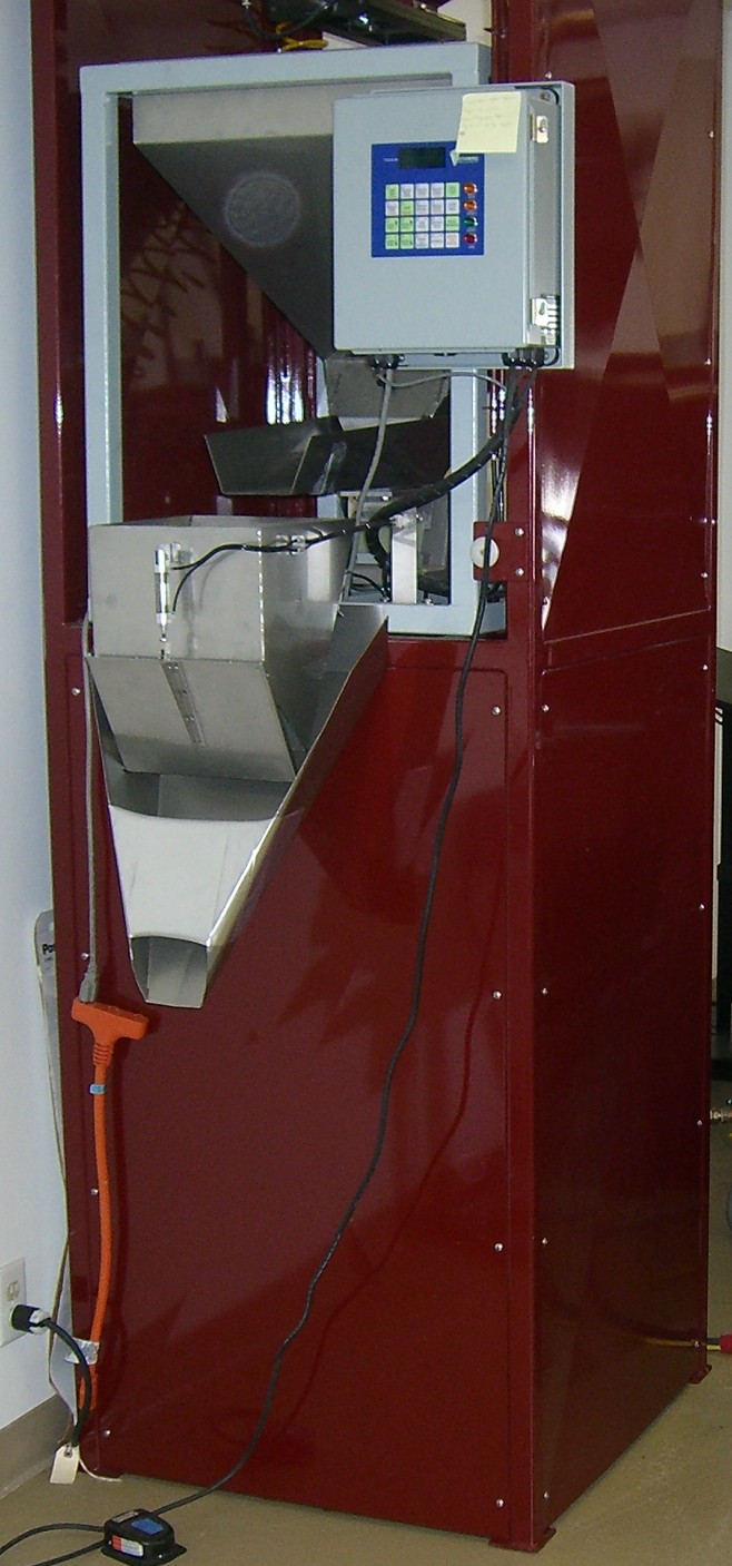 Industrial Weigh-Fill Packager — front view showing hopper and dispensing mechanism
